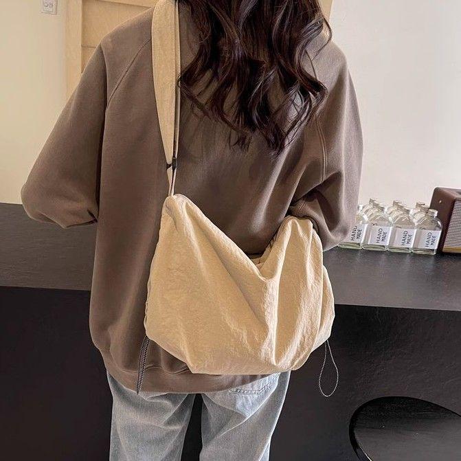 

Japanese Waterproof Nylon Dumpling Crossbody Bag - Unisex Large Capacity Tote for Cycling and Outdoor Activities