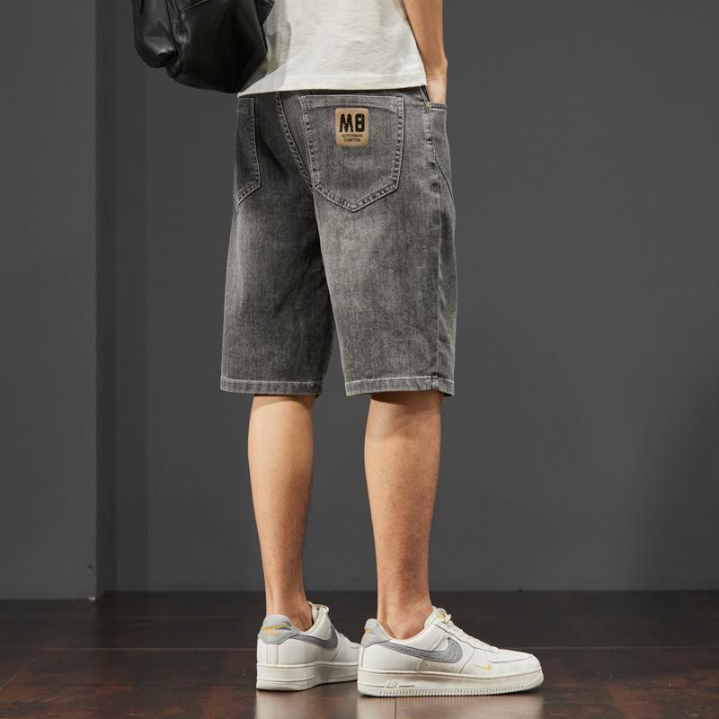 Pantaloncini di jeans da uomo, estivi sottili larghi dritti casual alla moda marca strappati cinque o sei divisione del lavoro pantaloni da uomo