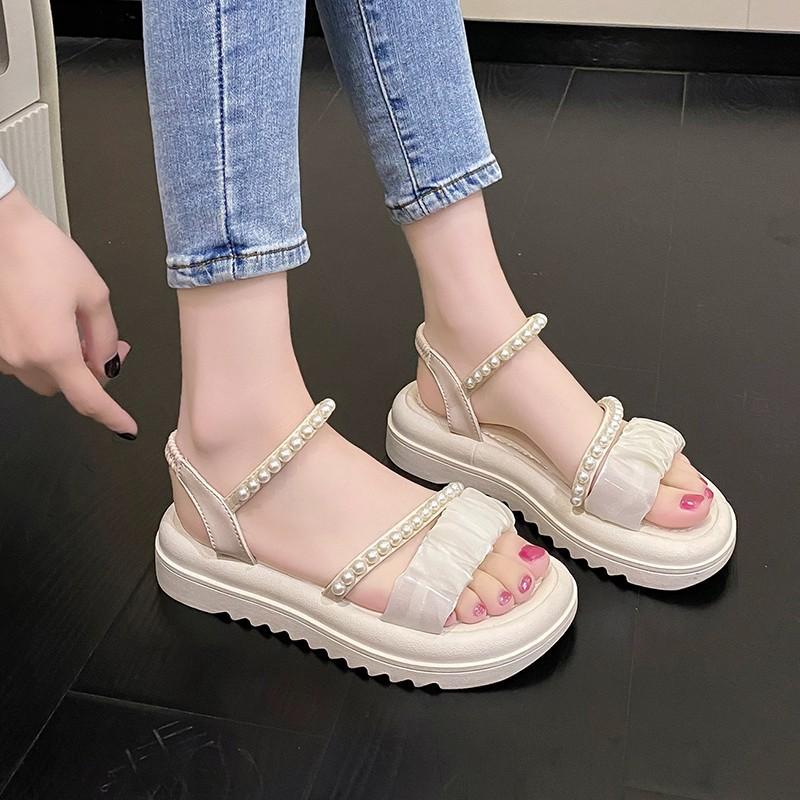 Stepping on shit sandals women's summer 2025 new beach shoes ins trendy fairy wind flat bottom wear non-slip Roman sandals