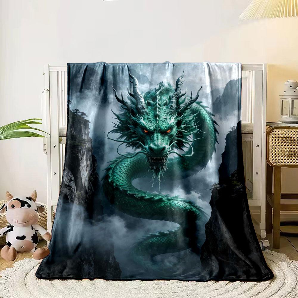 A green, serpentine dragon with glowing eyes emerges amidst misty cliffs. for all seasons blanket lunch break throw gift 80cm x 120cm