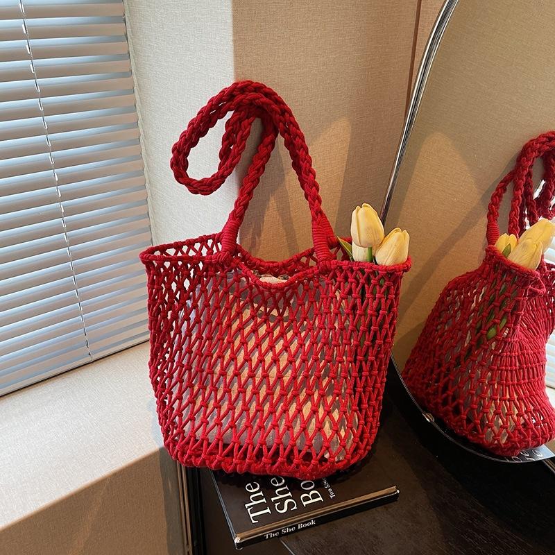 Borsa estiva in maglia traforata di nicchia da donna a grande capacità 2025 nuova borsa tote intrecciata borsa da spiaggia per le vacanze moda