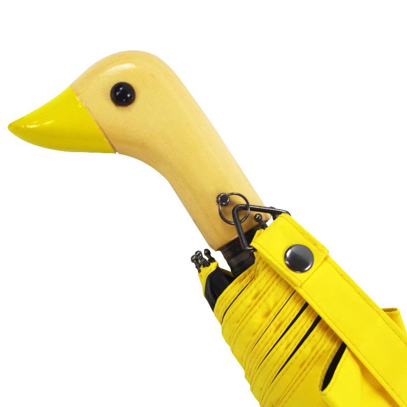 Cute Three-Fold Duck Head Umbrella: Cartoon Design, Wooden Handle, Solid Color for Rain or Shine.