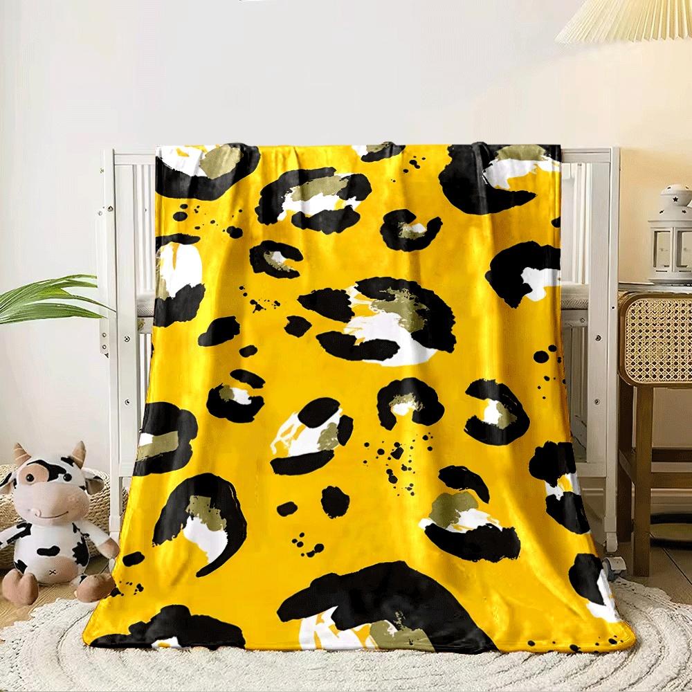 Abstract leopard print with black, white, and olive spots on yellow. for all seasons blanket lunch break throw gift