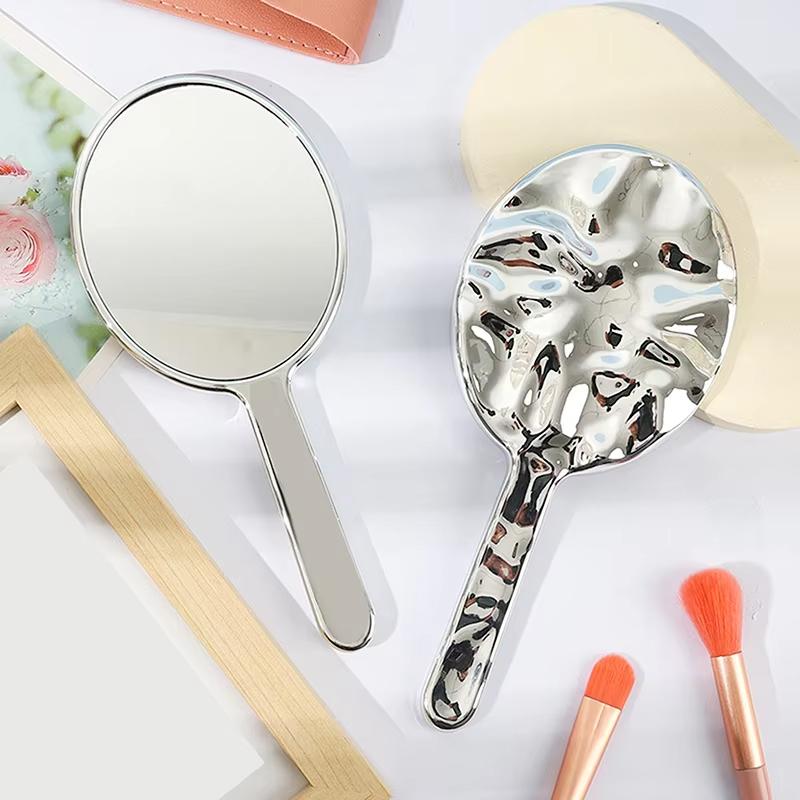 Flüssige Ellipsoidform Spiegel Handgehalten Desktop Kosmetik Make-up Spiegel Reise Tragbar Schönheit Glänzend Silber Spiegel für Handtasche