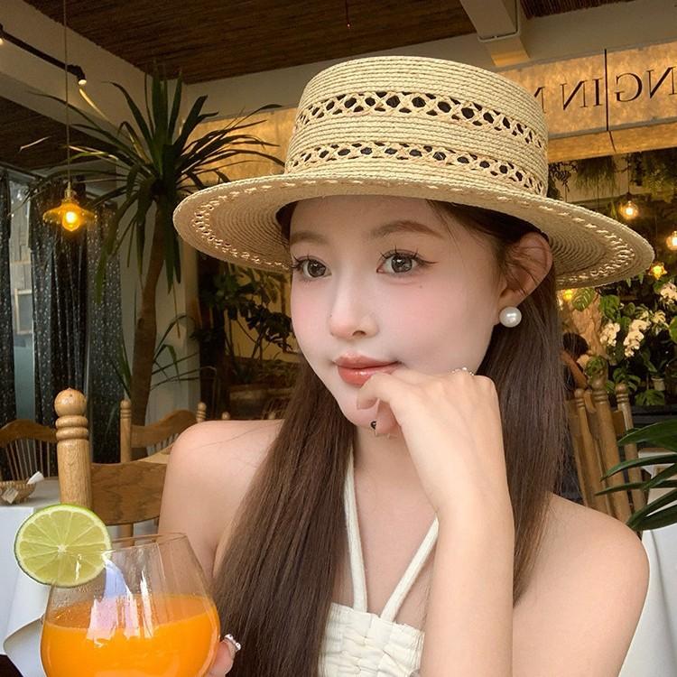 Hand-woven flat-top Lafite straw hat women's summer new hat hollow sunshade sunscreen hat French top hat