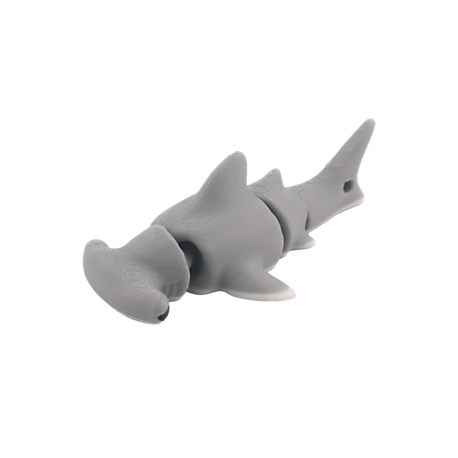 

Напечатанная на 3D-принтере акула-молот+акула, с подвижными суставами, имитирующая модели морских обитателей