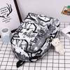 Nouveau Sac à Dos Scolaire Couple Lettres Graffiti Mode Loisirs Voyage Multifonctionnel