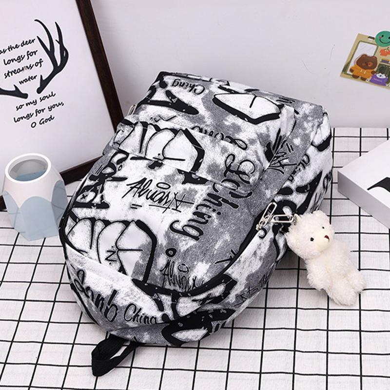 Nouveau Sac à Dos Scolaire Couple Lettres Graffiti Mode Loisirs Voyage Multifonctionnel