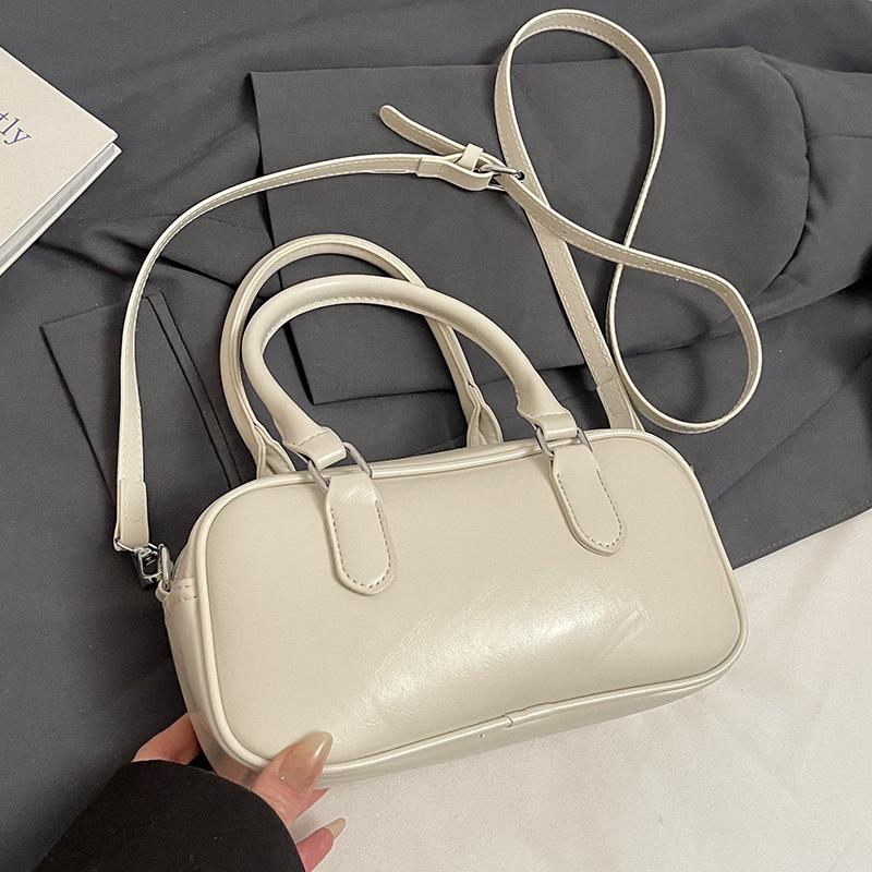 Retro commuting simple Korean version casual solid color portable bowling bag fashion high sense versatile commuting messenger bag