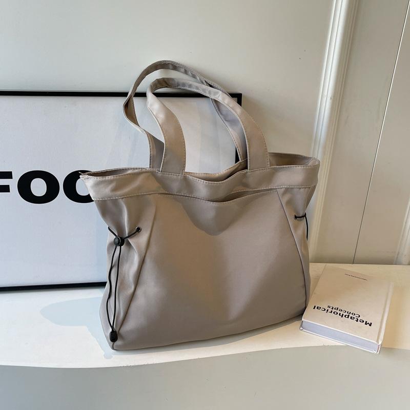 Large-capacity tote canvas bag, high-value commuting to work and going out, literary and artistic student clothing book, shoulder cloth bag bag.