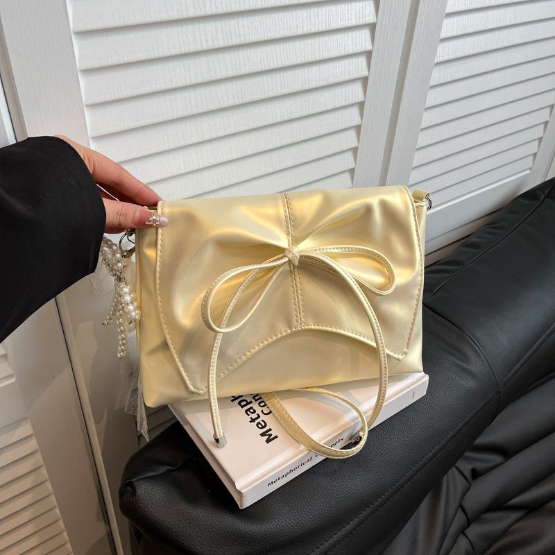 

Перламутровый милый литературный бант 2025 весна балетный стиль большая вместимость простой и элегантный сумка через плечо