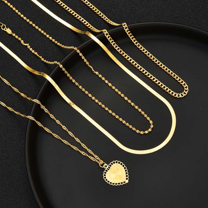 17KM 4pcs Fashion Gold Color Multi Layer Heart Pendant Necklaces for Women Exaggerated Metal Snake Bone Chain Necklaces Jewelry Set