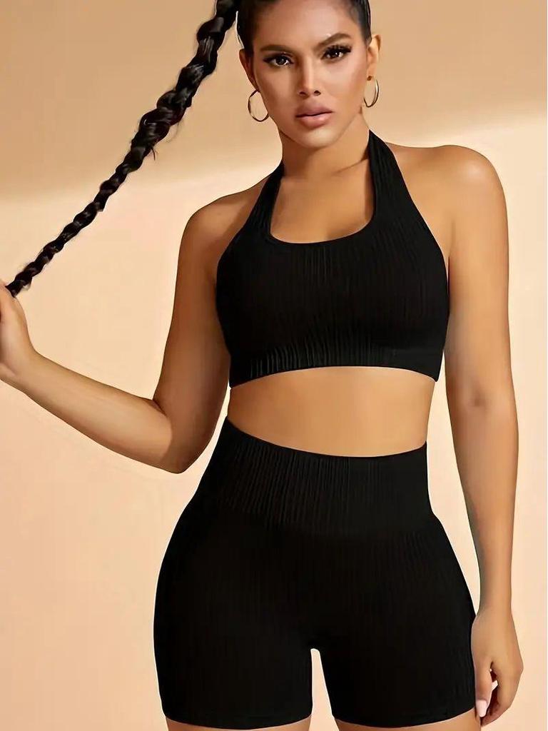 Seamless Knitted Halter Neck Two-Piece Sports Set for Women - Includes Back Detail Short Sleeve Top and Bra with Chest Pads, Plus Shorts.