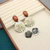 MONIES Wind Black Mother-of-Pearl Camellia Earrings - Elegant and Luxurious Style for Women