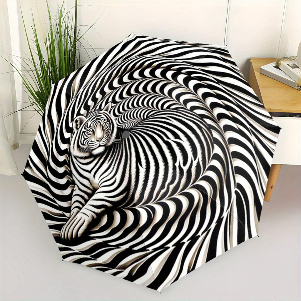 This Compact Umbrella Showcases a Striking Black And White Optical Illusion Design, Highlighted by a Large White Tiger in The