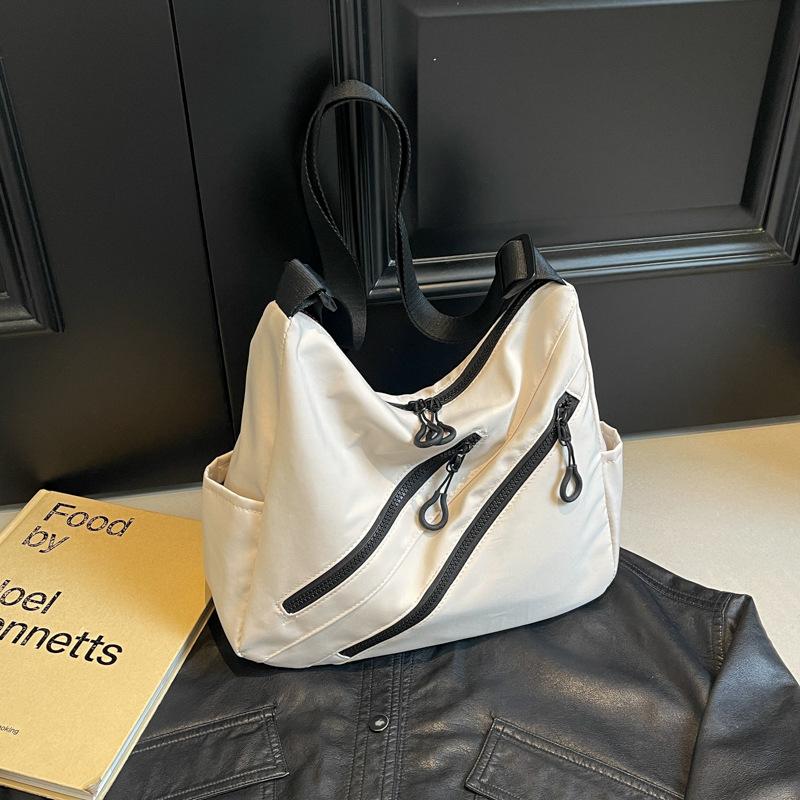 Fashion commuter large capacity shoulder bag women 2025 good-looking casual fashion tote bag simple Korean version armpit bag