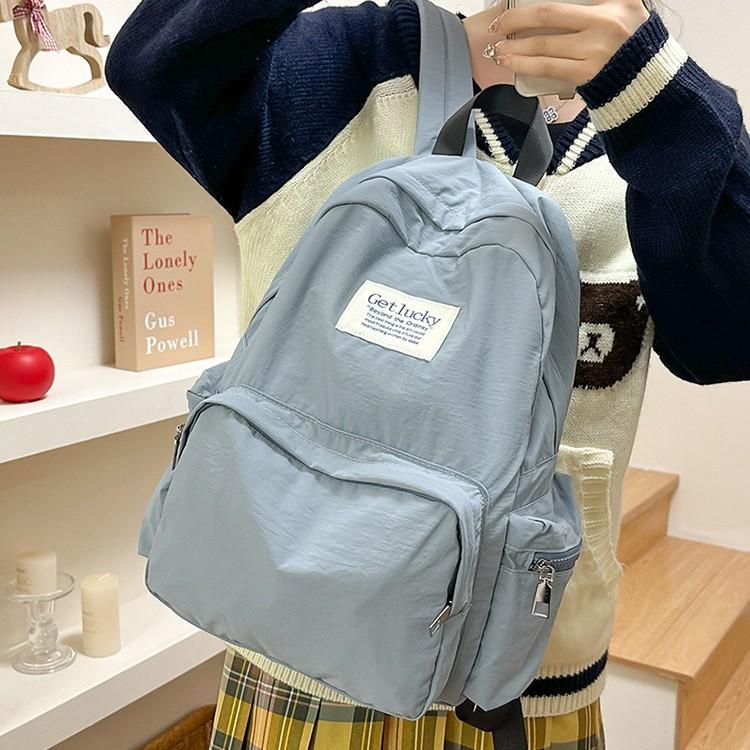 Schoolbag new Korean version large-capacity backpack female sweet and cute primary and secondary school schoolbag solid color simple travel backpack
