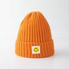 Smiley face label wool hat female autumn and winter warm bag head couple trendy brand cold hat solid color student male knitted hat