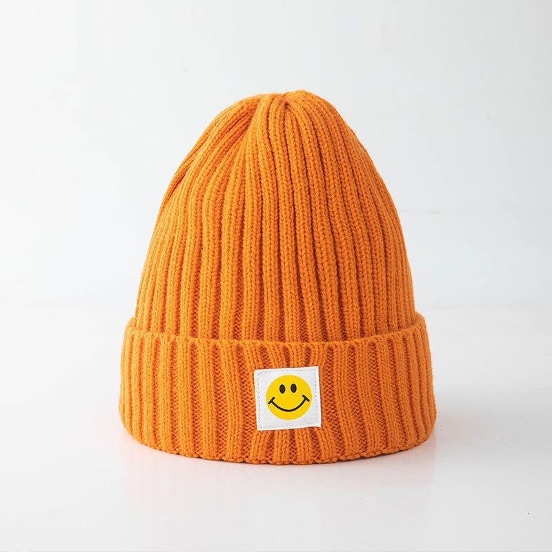 Smiley face label wool hat female autumn and winter warm bag head couple trendy brand cold hat solid color student male knitted hat