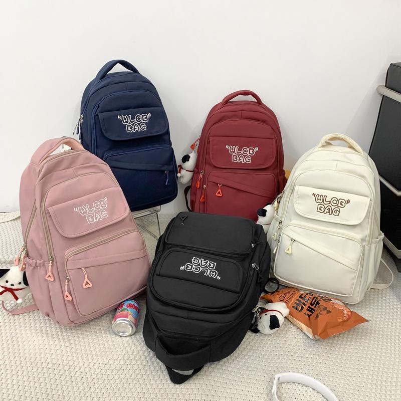 Student schoolbag 2023 new large-capacity alphabet backpack Korean version of junior high school backpack