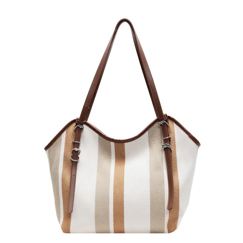 

Korean version of large-capacity shoulder bag women s new vertical striped ins tote bag fashion contrasting color commuter handbag One size бежевый