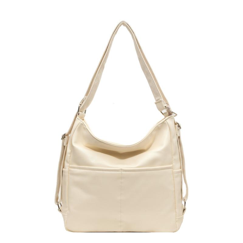 Lielas ietilpības pilsētas mugursoma sieviešu jauna pavasara un vasaras modes teksturēta plecu soma populāra retro iepirkumu soma