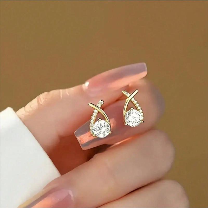 Gold Tone Teardrop Stud Earrings With Criss-Cross Cubic Zirconia Accents, Elegant Round-Cut Center Stone For Maximum Sparkle Comfortable Design