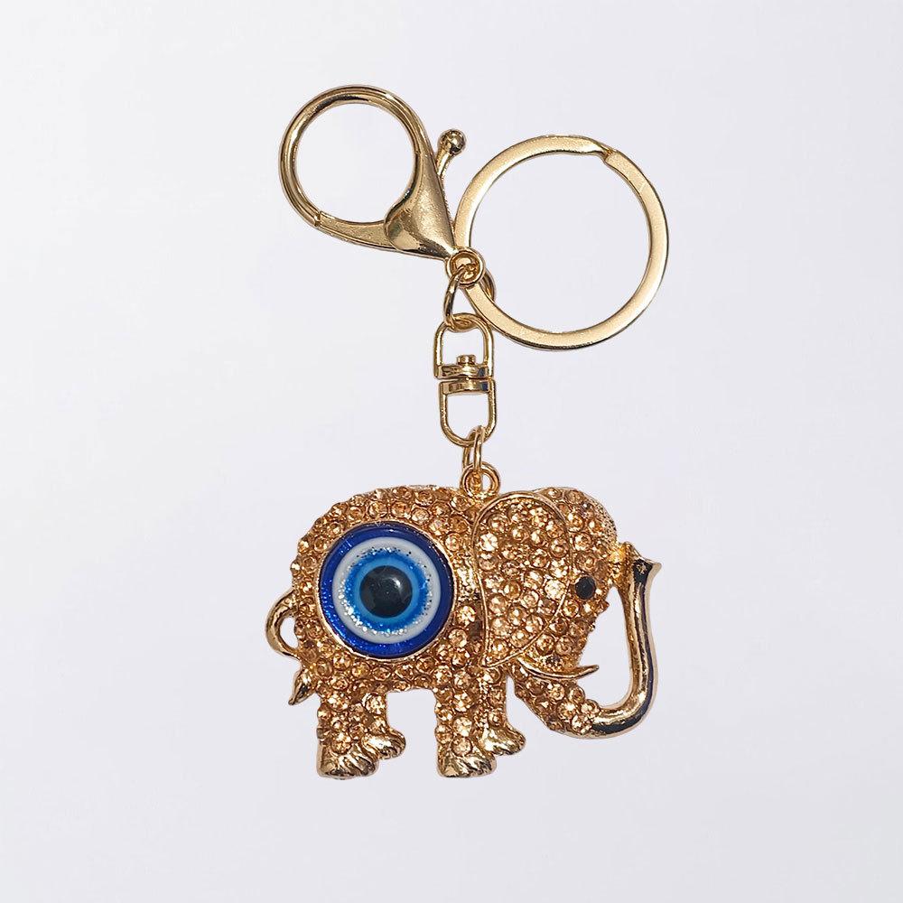 Neuer Schmuck mit blauen Augen - Diamantbesetzter metallisch farbener Elefanten-Schlüsselanhänger, Dämonenaugen-Anhänger