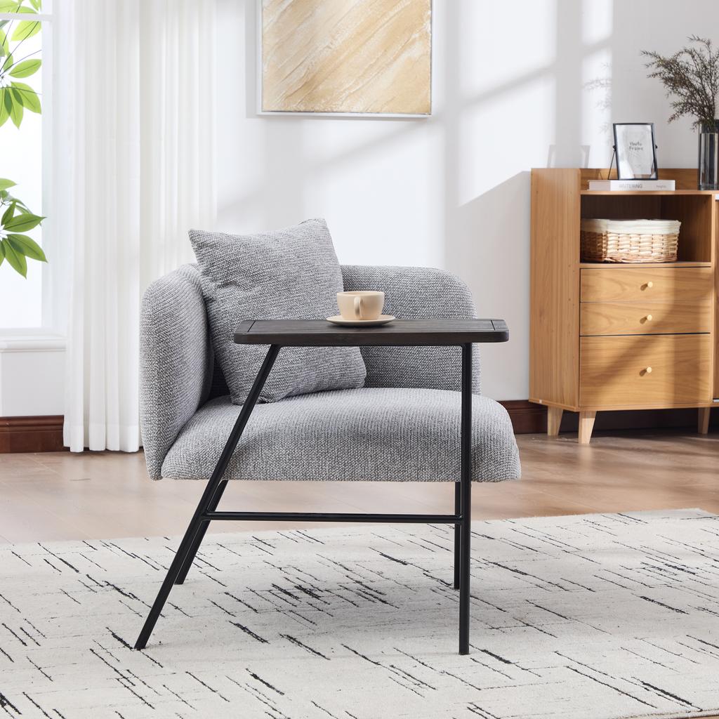 Modern single armchair with comfortable fabric backrest and two storage compartments, complemented by a practical side table.