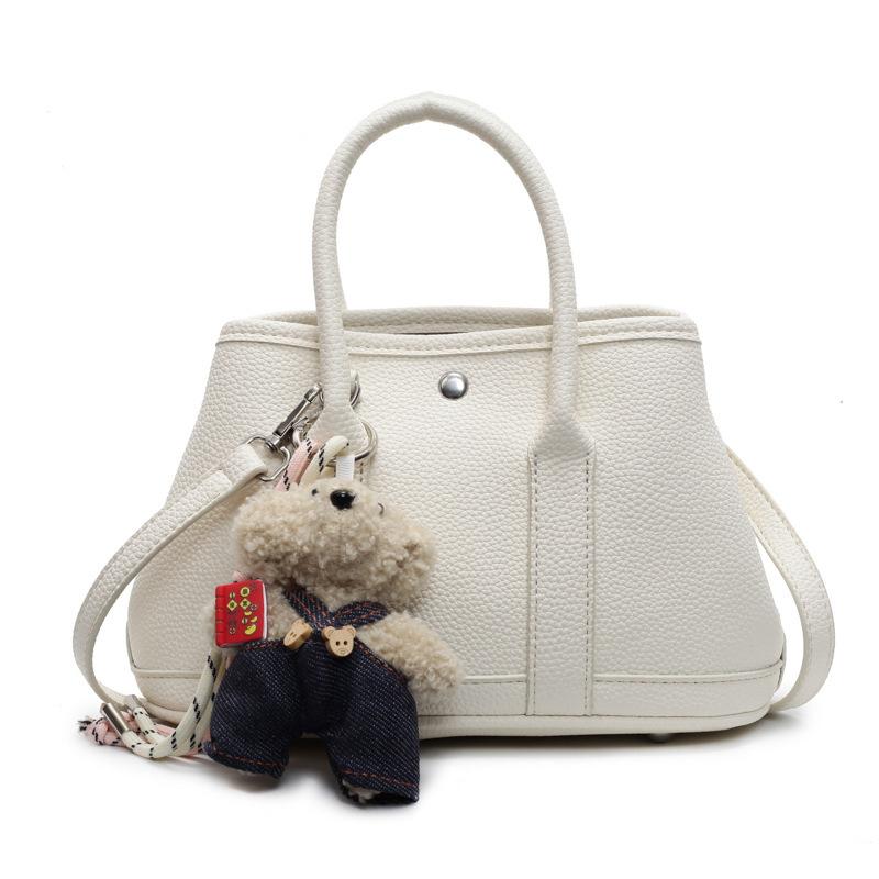 2025 New Niche Simple Leisure Commuter Portable Bucket Bag Versatile Solid Color Child and Mother Bag Messenger Bag Bag