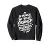 In He Will Be Wearing an Orange March, Sweatshirt.