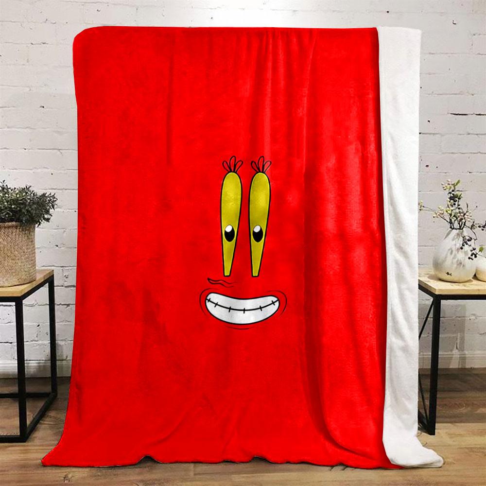 A cartoonish smiling face with big yellow eyes on a red background. for all seasons blanket lunch break throw gift