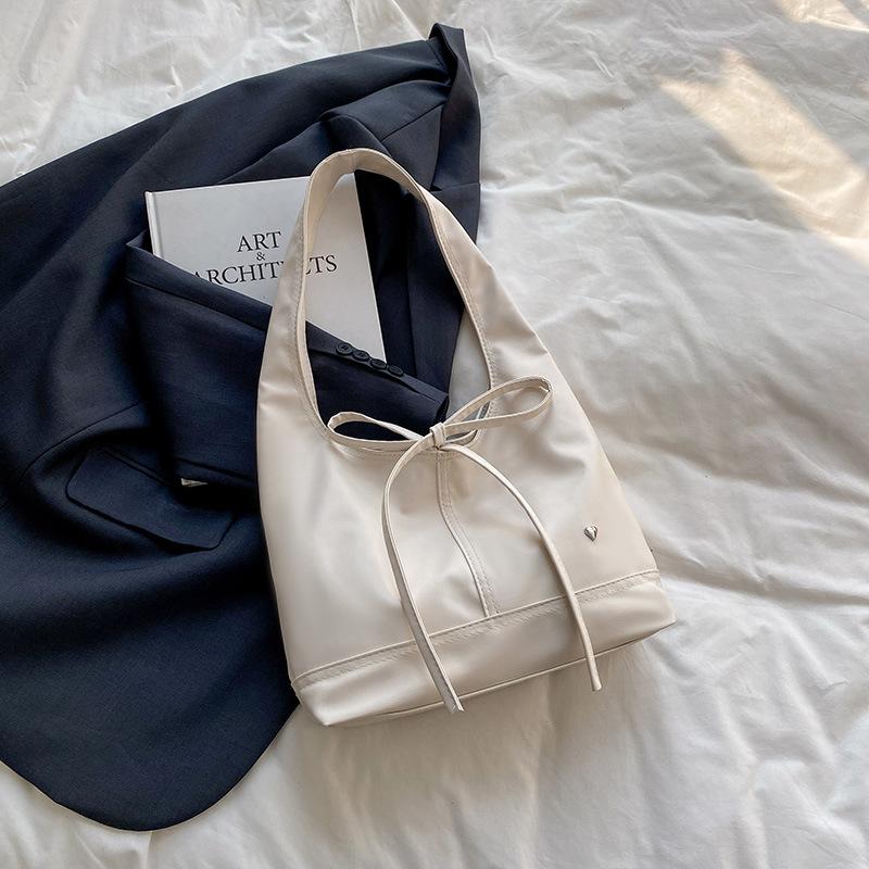 2025 Korean Version Niche Oil Wax Leather Commuter Women's Bag Versatile French Bow Large Capacity Shoulder Underarm Tote Bag