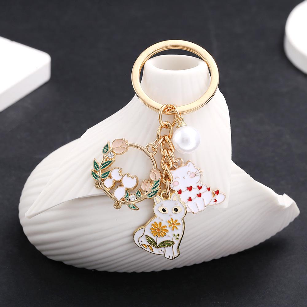 White Floral Cats Keychain with Heart and Pearl Accents
