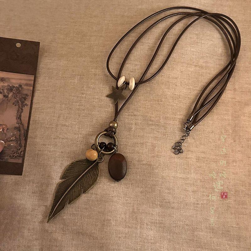 

Новое китайское дзен длинное ожерелье с подвеской из перьев для женщин, ретро, необычная цепочка для свитера, стиль отходов и почвы, художественное украшение Mori Long necklace [leaves]]