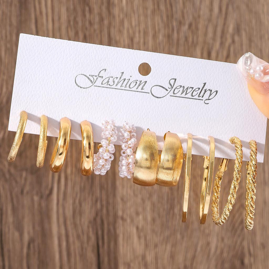 European and American new earrings set 1 pair of golden metal twist pearls creative retro simple and versatile earrings
