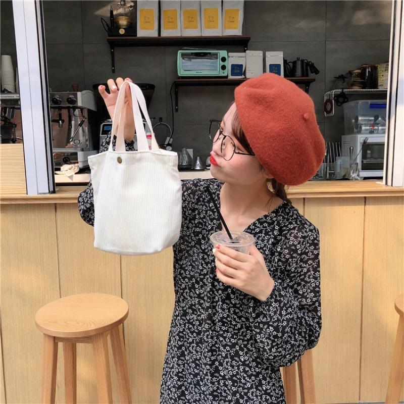 [Spot] Literary and artistic corduroy bag portable casual women's small hand bag retro cloth bag bento bag