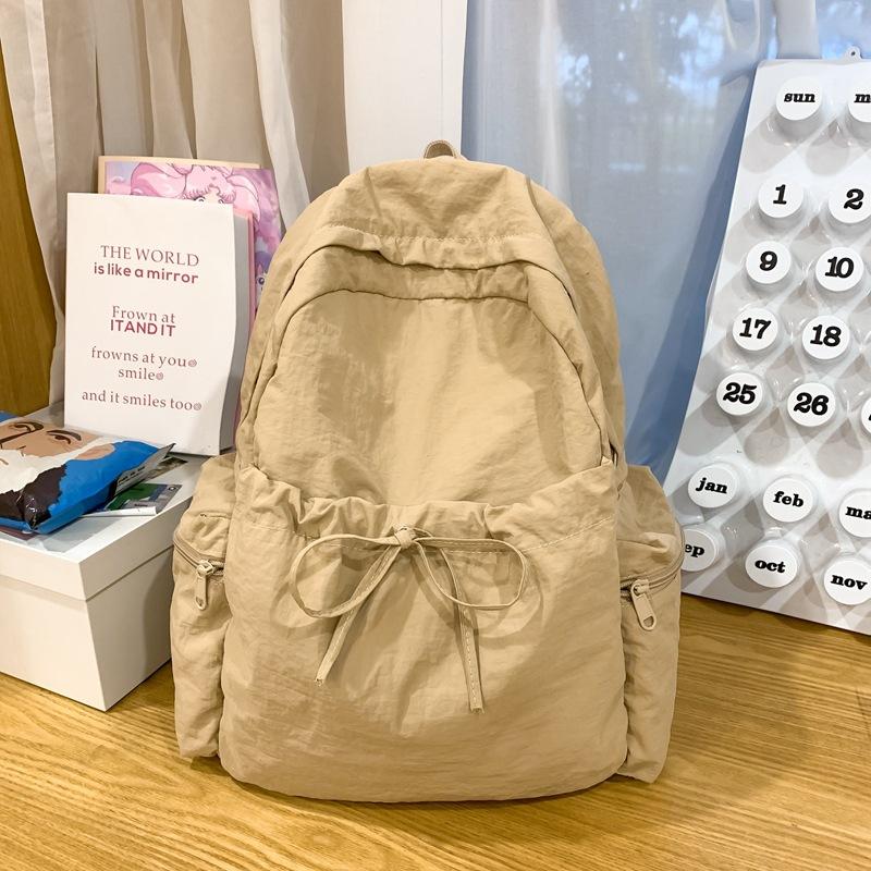 Niche design new simple backpack travel versatile backpack lightweight solid color large capacity student bag