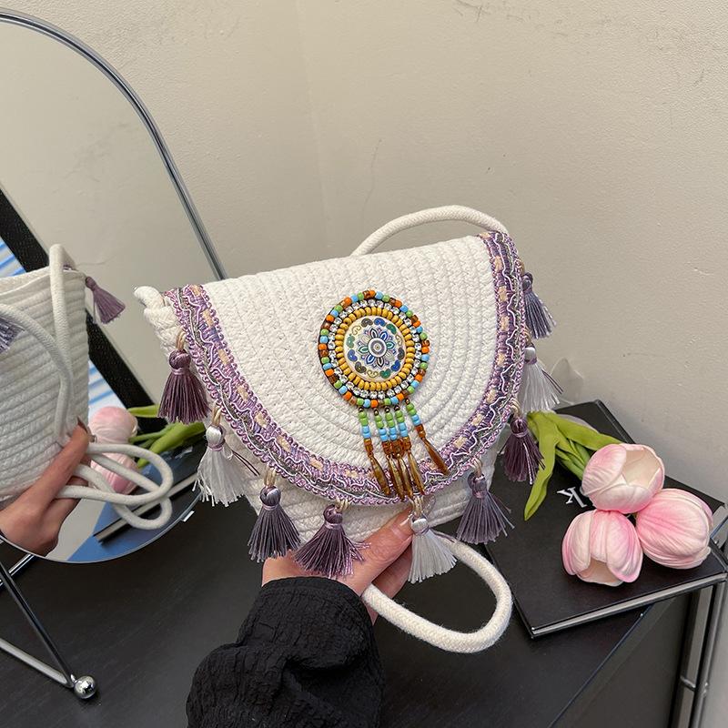 

2025 new simple ethnic style fashion popular straw bag fringed ball simple crossbody portable shoulder bag