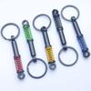 In-Stock Black Shock Absorber Keychain: Pressable Metal Spring Accessory - Perfect Small Gift