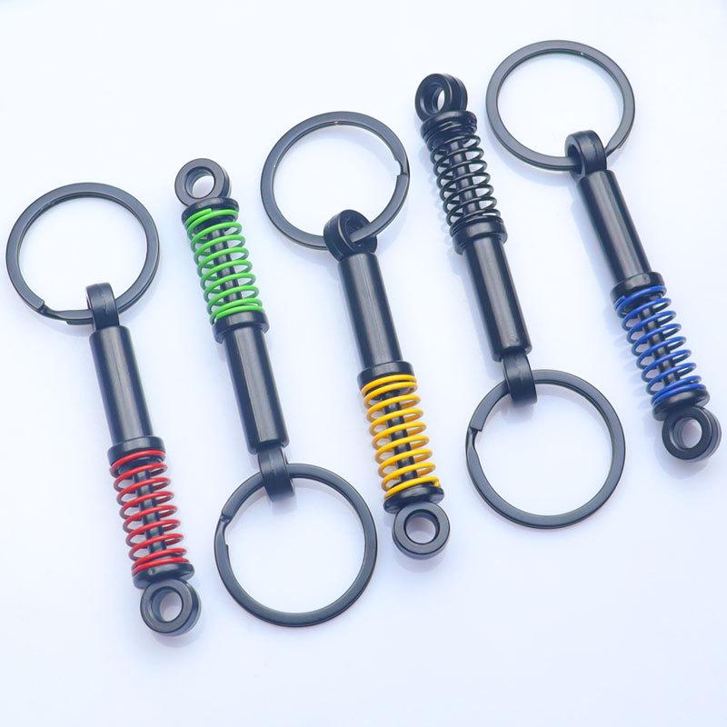 In-Stock Black Shock Absorber Keychain: Pressable Metal Spring Accessory - Perfect Small Gift