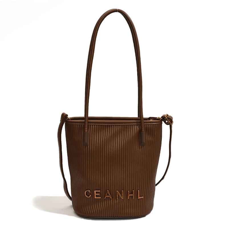 

2025 autumn and winter new small fragrant wind striped handbag simple bucket bag women s trend shoulder bag popular messenger bag