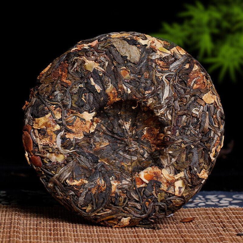 Discover 100g of Pu'er Raw Tea Plucked from Ancient Trees with Enchanting Floral Scent