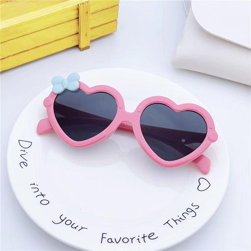 Neue Kinder-Sonnenbrille in Herzform Mädchen-Dekorative Schleife Sonnenbrille Niedliche Baby-Outdoor-Sonnenblende Brillen UV400