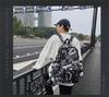 Trendiger Graffiti Rucksack mit großem Fassungsvermögen für Studenten - Vielseitige Umhängetasche für Männer & Frauen