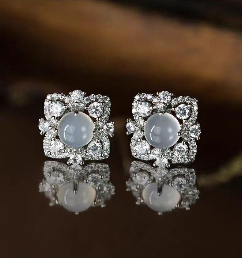 

2026 Secret Realm Eye Imitation White Chalcedony Full Diamond Flower Stud Earrings Women s Simple Temperament Earrings Niche Water Foam Jade High