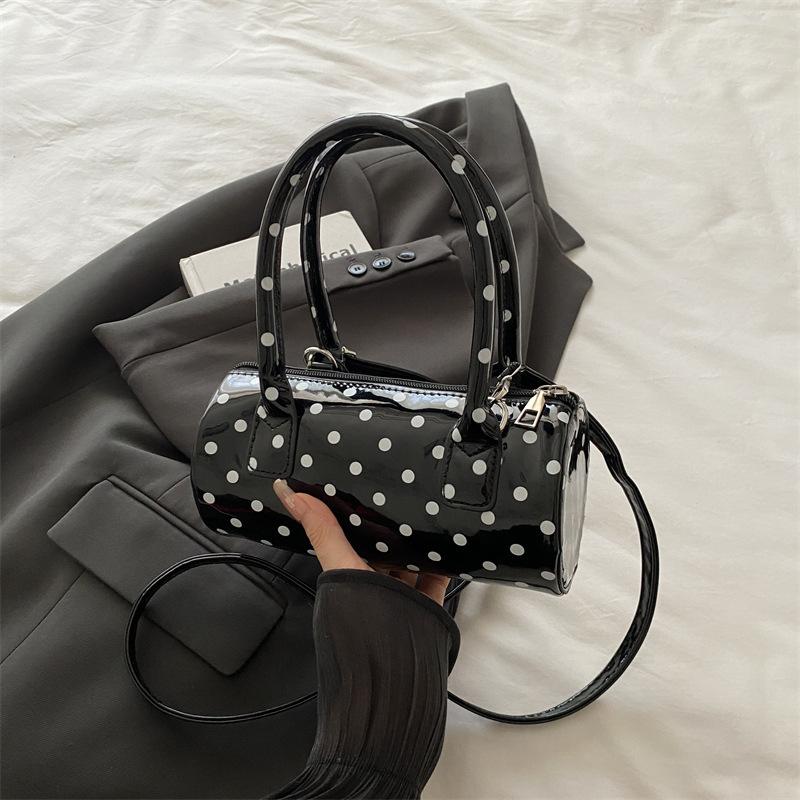 Niche polka dot bag women's 2025 bag new French retro underarm messenger bag exquisite portable women's bag cylindrical bag