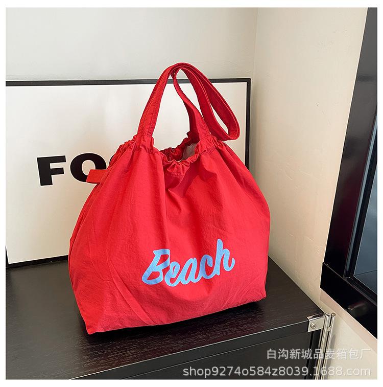 

Trendy versatility contrast print letter shoulder bag elastic closure design casual large capacity canvas bag commuter woman