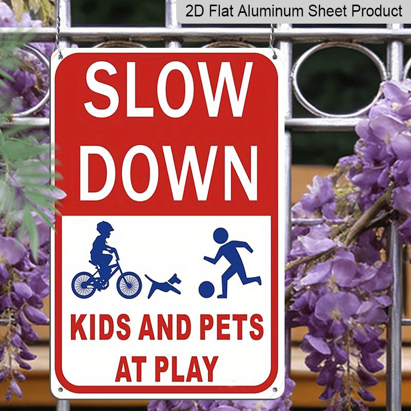 2D Flat Slow Down At Play Metal Sign - Durable Metal Safety Signage, 12*8 Inches, Easy To Install, Red and White with Blue Graphics, Perfect for