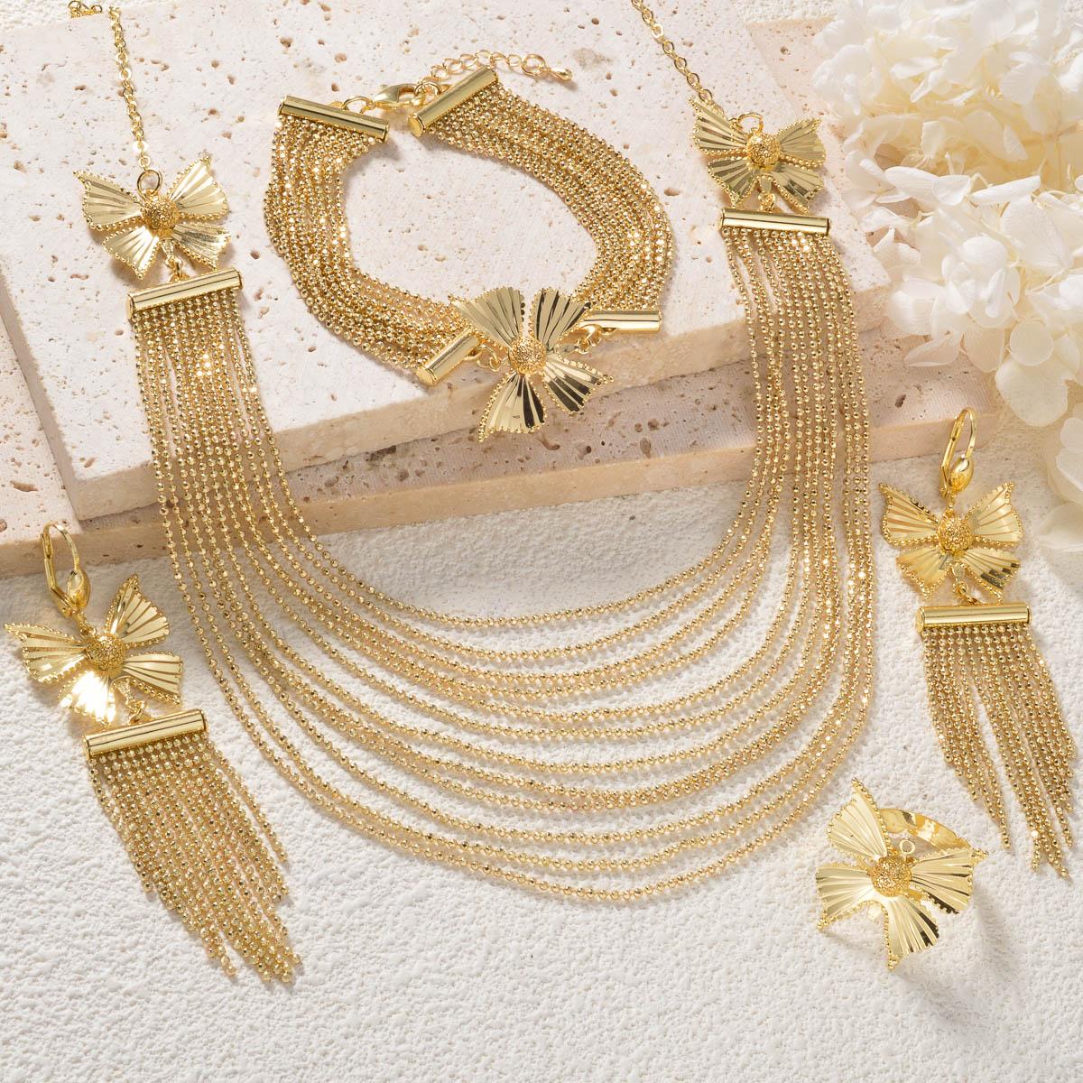 

Дубайский набор из четырех предметов с 18-каратным золотым покрытием: ожерелье, браслет, кольцо, серьги. Набор с многорядной цепочкой. Красивый свадебный набор для невесты. Подарки.